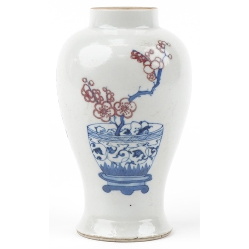 318 - A Chinese porcelain baluster vase hand painted with still life flowers in a vase and script, 16cm hi... 