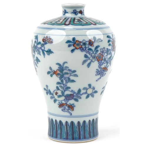 316 - A Chinese porcelain baluster vase hand painted with flowers, character marks to the base, 15cm high.