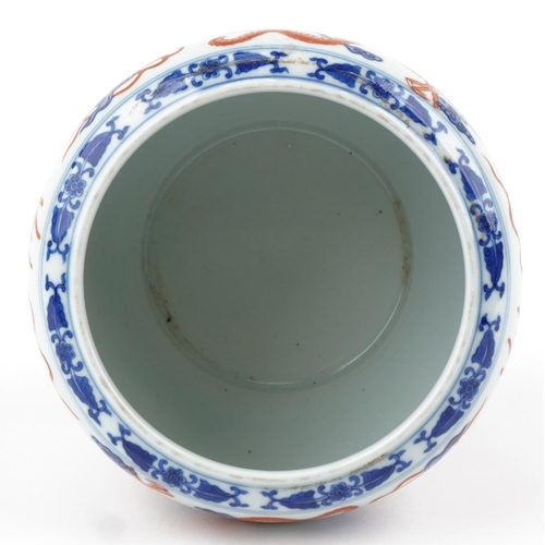 320 - A Chinese porcelain jardinière hand painted with dragons amongst clouds, character marks to the base... 