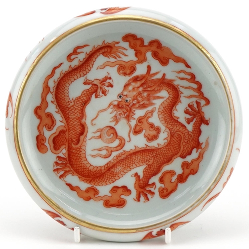 322 - A Chinese porcelain brush washer hand painted with a dragon, bats and crashing waves, 15cm in diamet... 