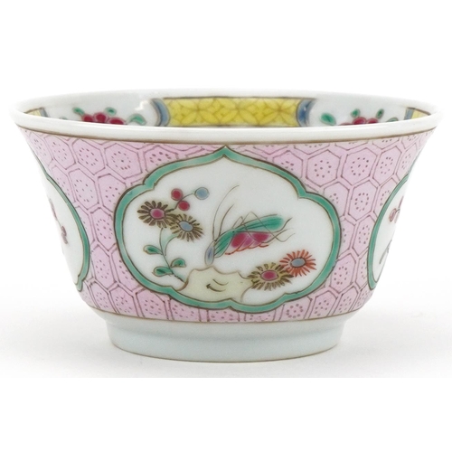 336 - A Chinese porcelain tea bowl and saucer hand painted with butterflies, flowers and birds on branches... 