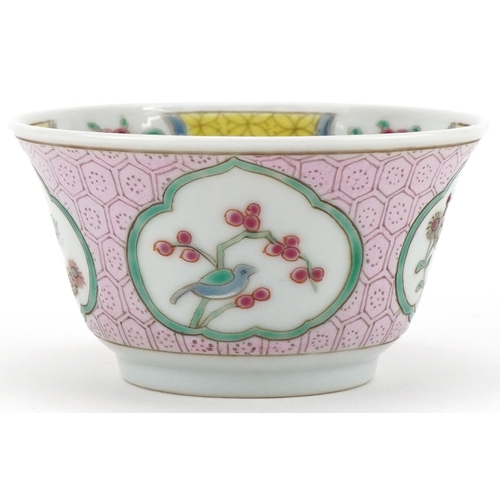 336 - A Chinese porcelain tea bowl and saucer hand painted with butterflies, flowers and birds on branches... 