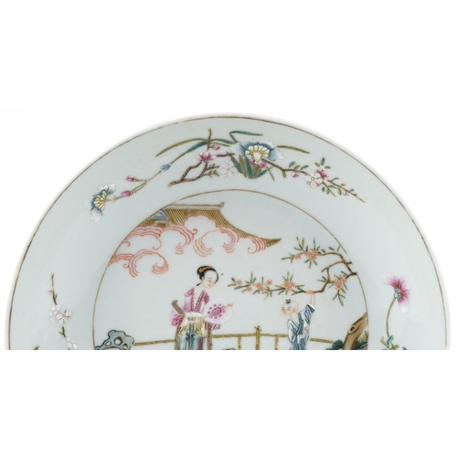 280 - A Chinese porcelain shallow dish hand painted with a Geisha and young figure in a courtyard amongst ... 