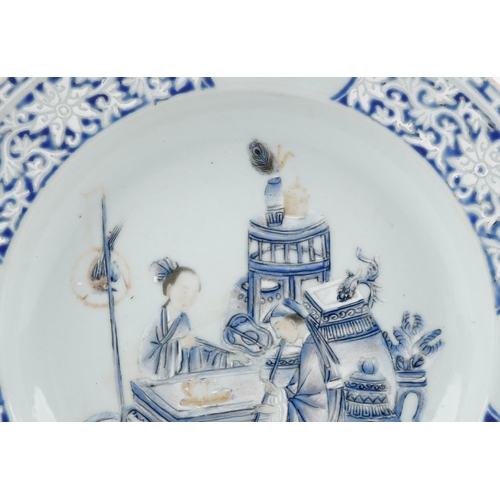 304 - A Chinese blue and white porcelain plate hand painted with musicians and objects amongst a floral bo... 