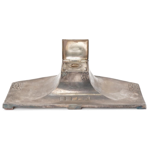 126A - WMF, a German Art Nouveau pewter inkwell with glass liner, 33cm wide.