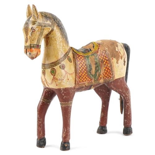 123 - Indian carved wood hand painted marriage horse, 39cm high.