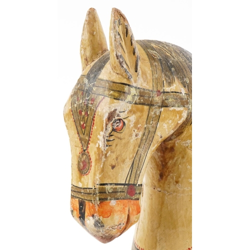 123 - Indian carved wood hand painted marriage horse, 39cm high.