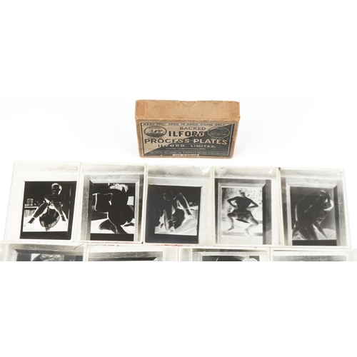 2290 - Collection of risqué black and white photographic slides of females housed in an Ilford box.