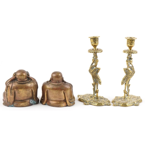 1423 - Two Chinese bronzed seated figures of Buddha and a pair of gilt brass candlesticks in the form of st... 