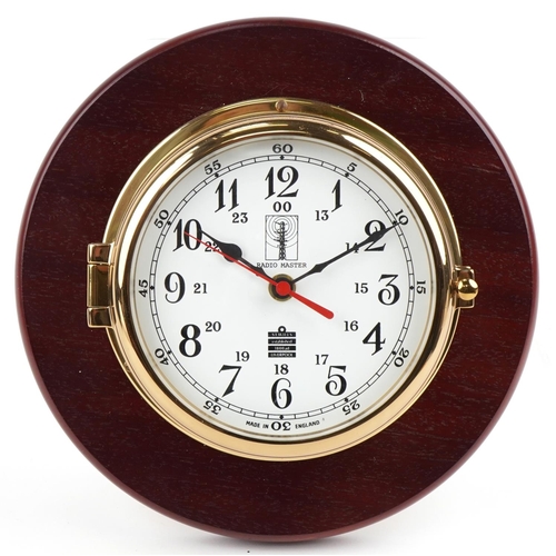 284 - A Sewills ship's bulkhead design wall clock with certificate and box, overall 25cm in diameter.