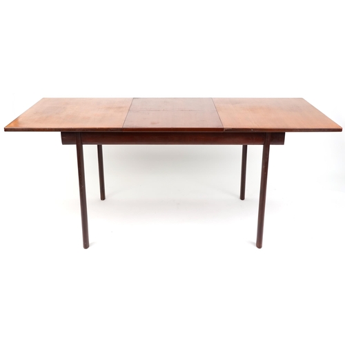 1010 - A mid/late 20th century teak extending dining table by White & Newton Ltd, Portsmouth, 72cm high x 1... 