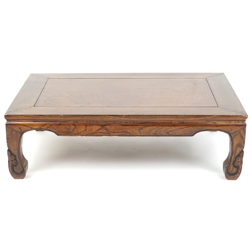 1079 - A Chinese softwood coffee table, late 20th century, the rectangular top raised on carved legs, 33cm ... 