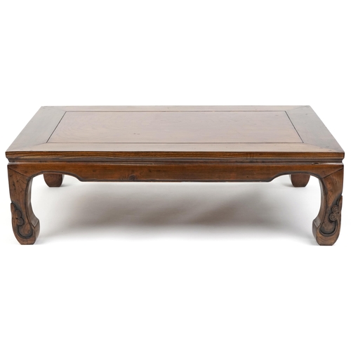 1079 - A Chinese softwood coffee table, late 20th century, the rectangular top raised on carved legs, 33cm ... 