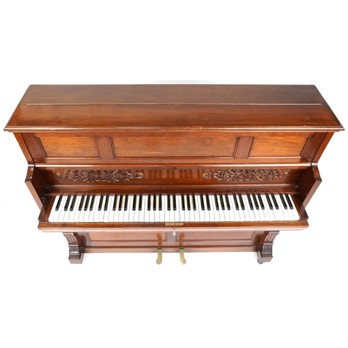 1080 - An unusual early 20th century mahogany cased fall-front upright piano, 115cm H x 136cm W x 51cm D.