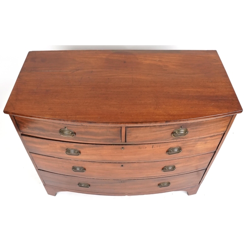 1003 - A George III mahogany bow front chest of two short and three long drawers on bracket feet, 97cm H x ... 