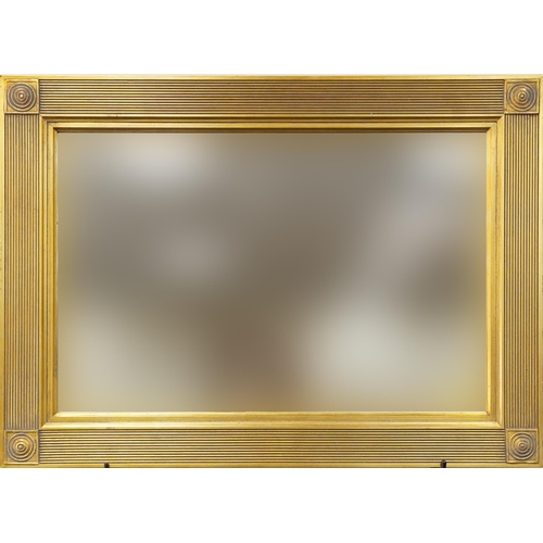 1127 - A modern rectangular gilt framed wall mirror, 68cm x 94cm.