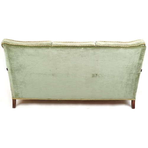 1072 - A George V three piece mahogany framed bergère suite upholstered in green velour comprising three se... 