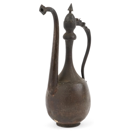 124 - A Turkish Ottoman brown patinated metal hot water jug, 19th century, with profusely engraved decorat... 