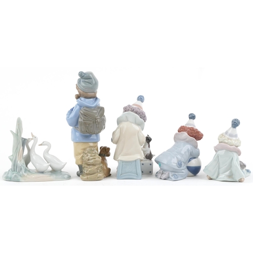 1200 - Three Lladro porcelain clowns together with Nao porcelain young girl with dog and Nao geese, the lar... 