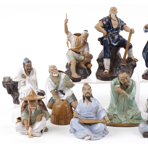 1351 - Thirteen Chinese pottery figures, late 20th century, the largest 24cm high.