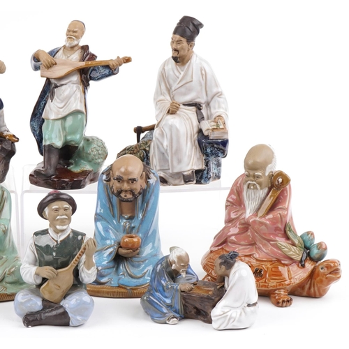 1351 - Thirteen Chinese pottery figures, late 20th century, the largest 24cm high.