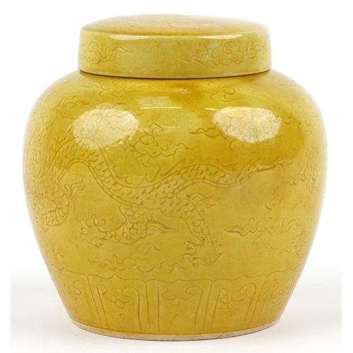 282 - A Chinese porcelain yellow glazed ginger jar and cover hand painted with a dragon chasing the flamin... 