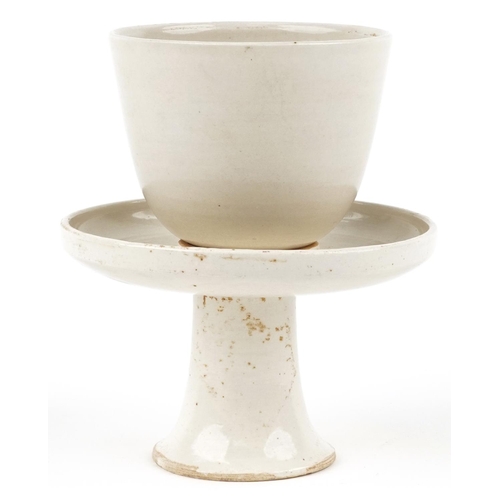 183 - A Chinese porcelain green glazed rice bowl on pedestal stand, 14cm high.