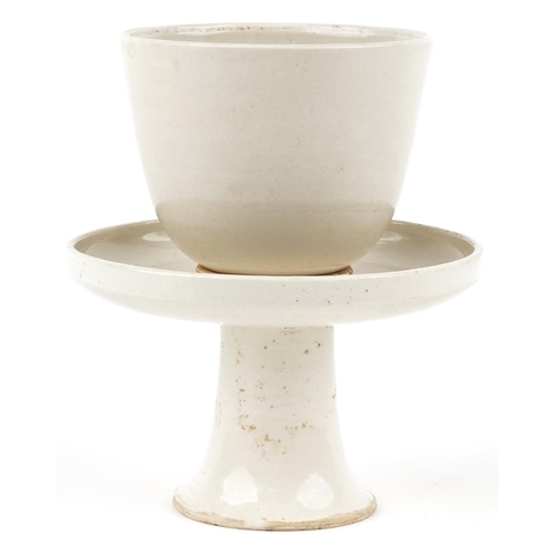 183 - A Chinese porcelain green glazed rice bowl on pedestal stand, 14cm high.