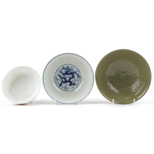 281 - Three Chinese porcelain bowls including a blue and white example decorated with dragons amongst clou... 