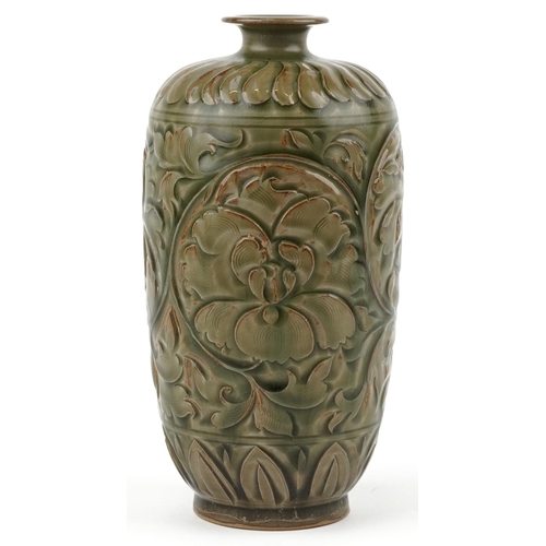 246 - A Chinese porcelain vase decorated in relief with foliage, 22cm high.