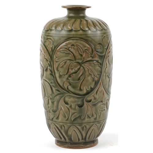 246 - A Chinese porcelain vase decorated in relief with foliage, 22cm high.