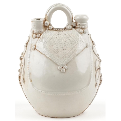 48 - A Chinese porcelain cream glazed water vessel in the form of a bag, 27cm high.