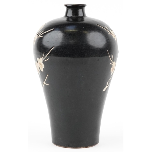 278 - A Chinese porcelain baluster vase decorated with cherry blossom onto a black ground, 29cm high.