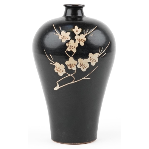 278 - A Chinese porcelain baluster vase decorated with cherry blossom onto a black ground, 29cm high.