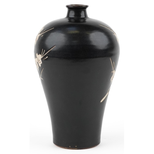 278 - A Chinese porcelain baluster vase decorated with cherry blossom onto a black ground, 29cm high.