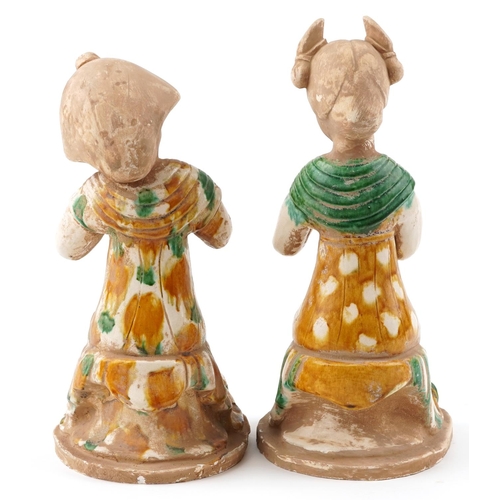 156 - A pair of Chinese Tang style pottery figures of females, the largest 38.5cm high.