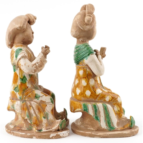 156 - A pair of Chinese Tang style pottery figures of females, the largest 38.5cm high.