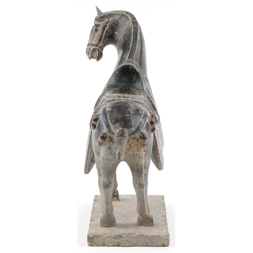 49 - A Chinese reconstituted carved hardstone study of a Tang horse having hand painted decoration, 37cm ... 