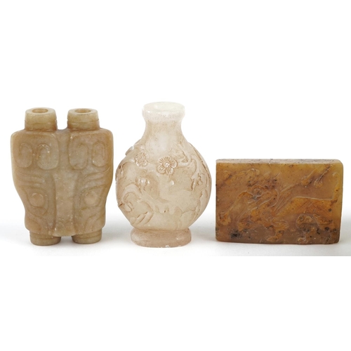 361 - Chinese carved stone objects including two scent bottles and a translucent dish raised on a gilt bro... 