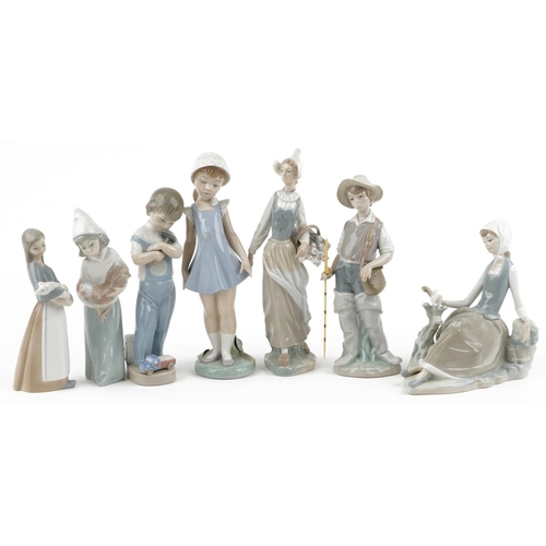 1195 - Seven Lladro porcelain figures and figurines including young fisherman and girl holding a chicken, t... 