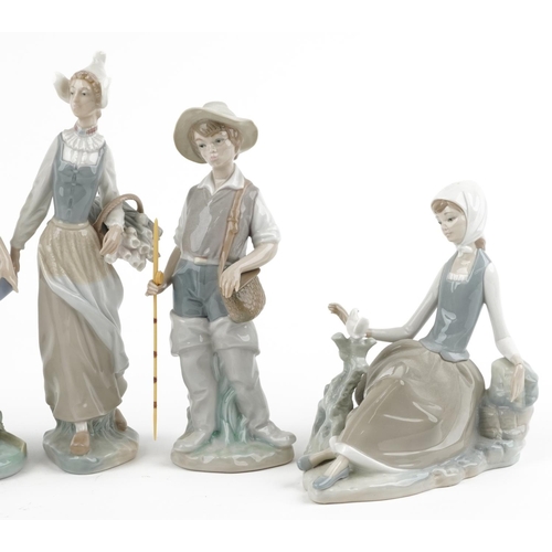 1195 - Seven Lladro porcelain figures and figurines including young fisherman and girl holding a chicken, t... 