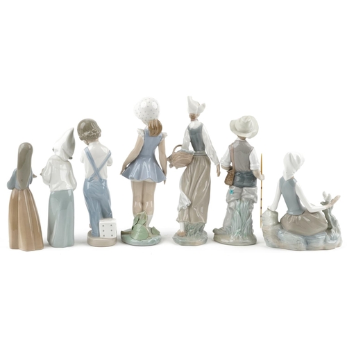 1195 - Seven Lladro porcelain figures and figurines including young fisherman and girl holding a chicken, t... 