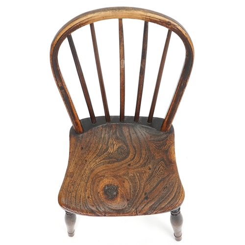 1074 - A 19th century beech and elm child's Windsor chair, 64cm H x 32cm W x 32cm D.