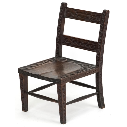  An early 20th century Arts & Crafts oak low chair circa 1910, probably by The Bray Art Furniture Ind... 