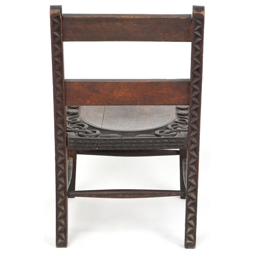  An early 20th century Arts & Crafts oak low chair circa 1910, probably by The Bray Art Furniture Ind... 