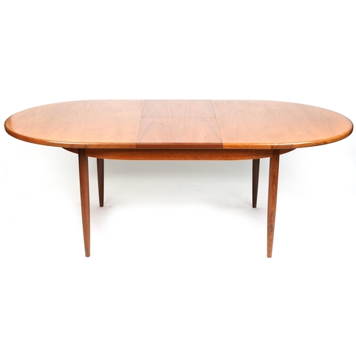 1012 - A G Plan teak extending dining table, 164cm in length, together with four similar late 20th century ... 