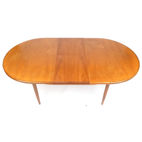 1012 - A G Plan teak extending dining table, 164cm in length, together with four similar late 20th century ... 