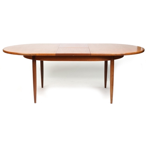 1012 - A G Plan teak extending dining table, 164cm in length, together with four similar late 20th century ... 