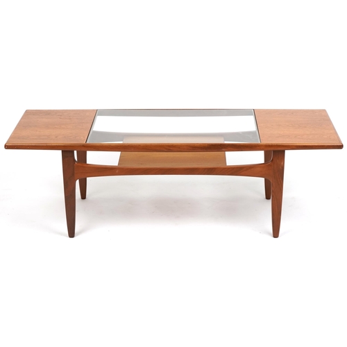 1011 - A G Plan teak coffee table with inset glass top above an under tier, 43cm H x 137cm W x 51cm D.