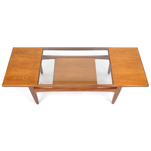 1011 - A G Plan teak coffee table with inset glass top above an under tier, 43cm H x 137cm W x 51cm D.